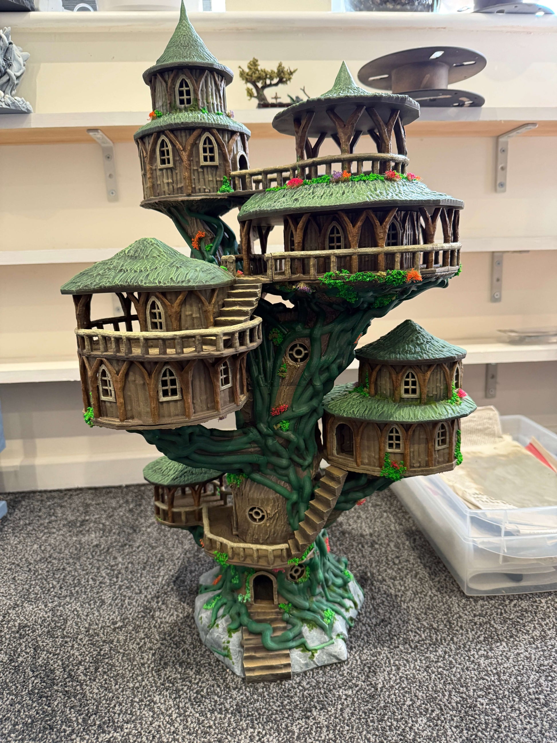 A fully painted and fully assembled version of the grand treehouse D&D terrain piece.